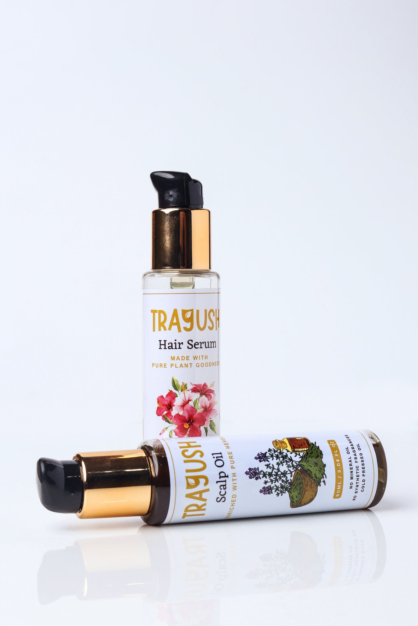Trayush hair serum and scalp oil bottles on a white background