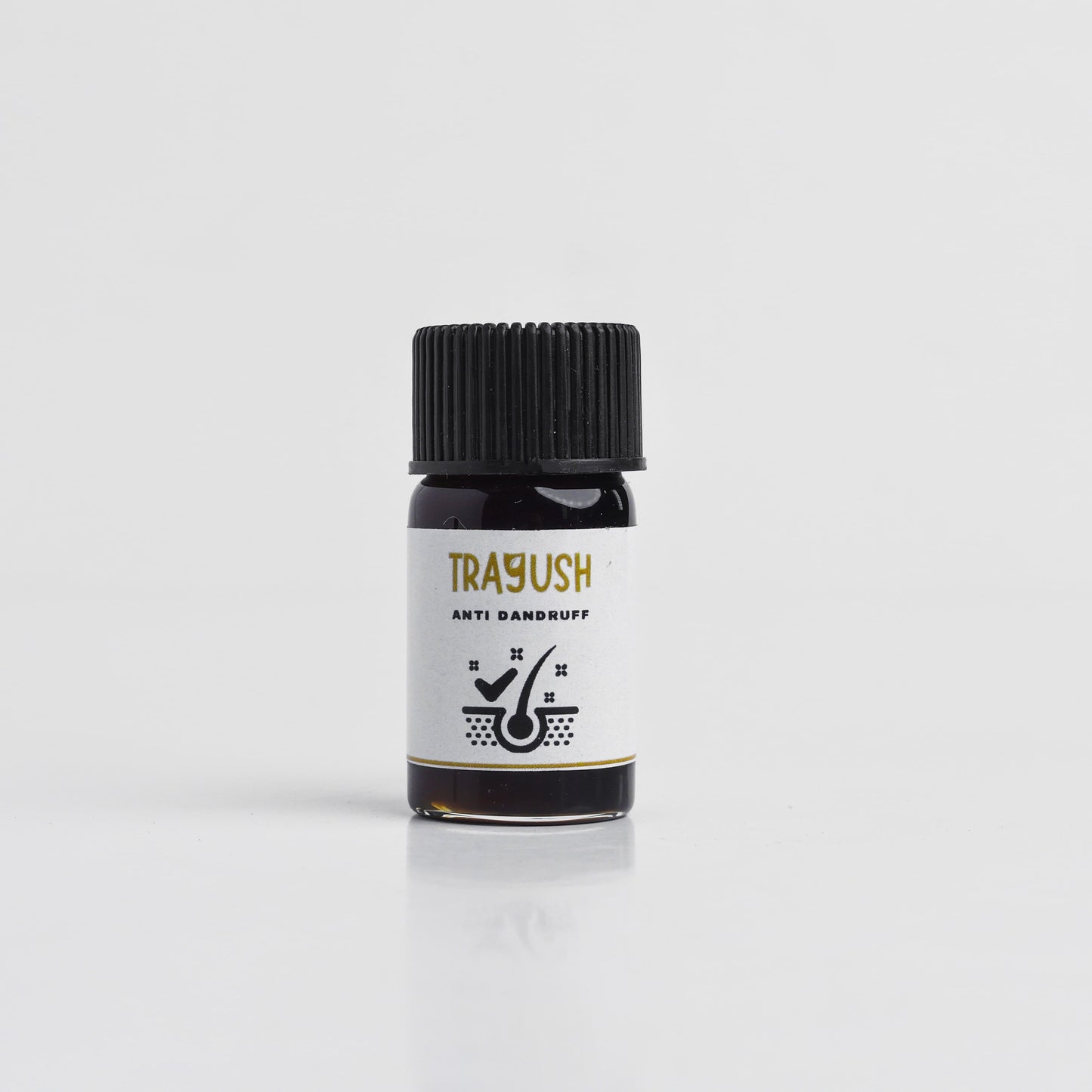 Bottle of Trayush anti dandruff product on a white background