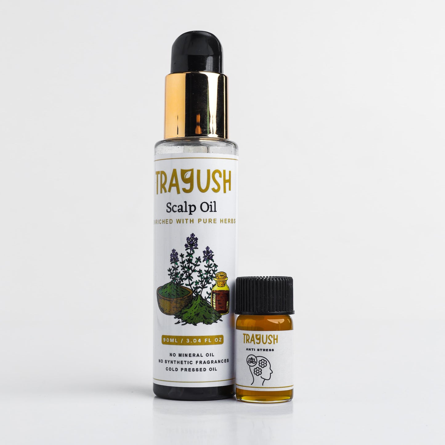 Two bottles of Trayush scalp oil on a white background