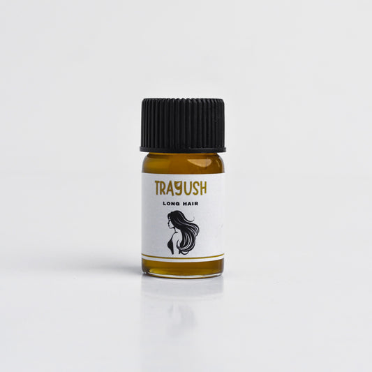 Bottle of Trayush hair product on a white background