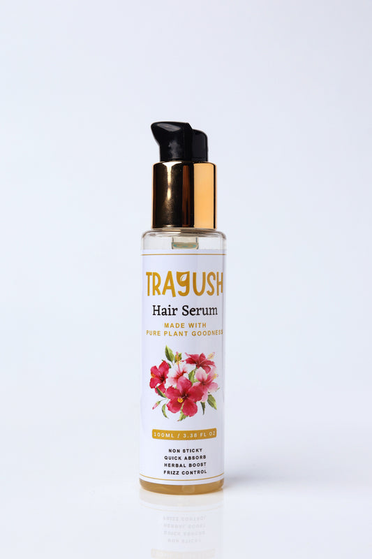 Trayush hair serum bottle with floral design on a white background