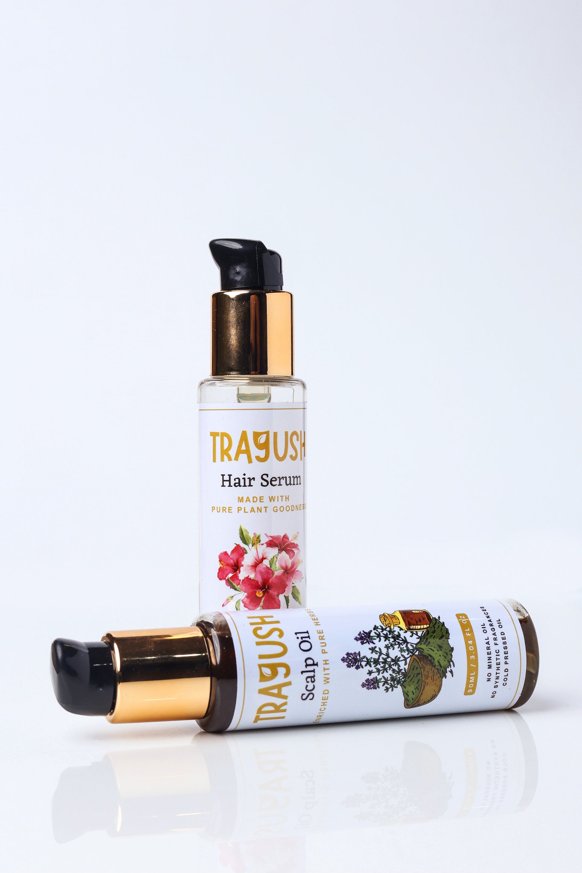 Trayush hair serum and scalp oil bottles on a white background