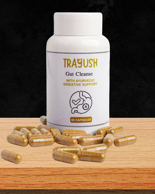 TRAYUSH Gut Cleanse supplement bottle with capsules on a wooden surface