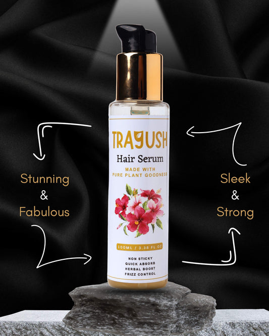 Trayush hair serum bottle with floral design on a black background