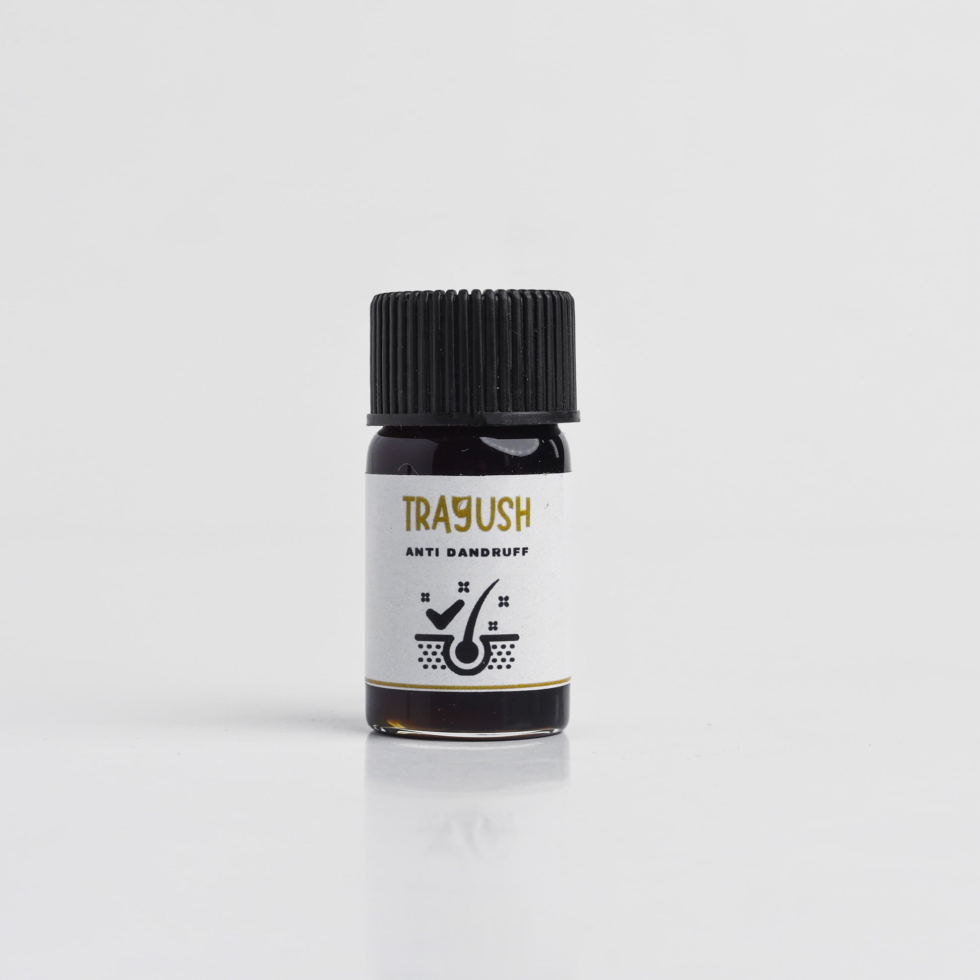 Bottle of Trayush anti dandruff product on a white background