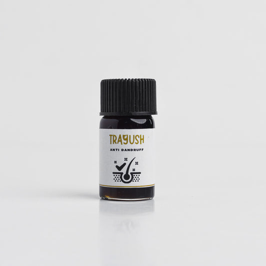 Bottle of Trayush anti dandruff product on a white background